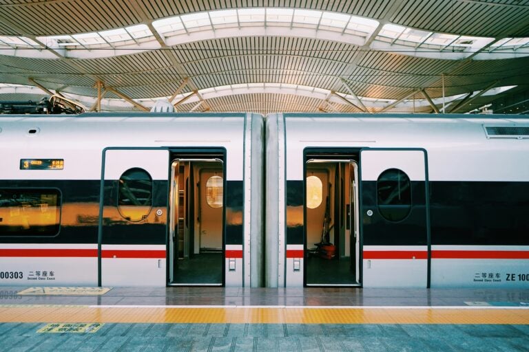 Metro station in Manchester with a train just fully boarded with passengers.
