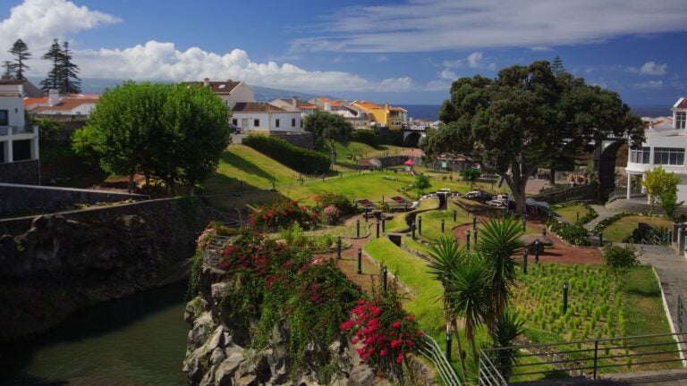 Colorful hillside village overlooking the ocean on São Miguel Island in the Azores, Portugal