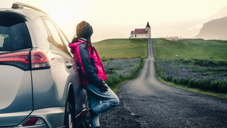Woman traveling by car in Europe 