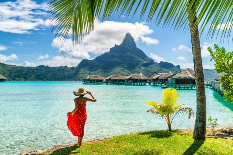 woman watching the bora bora landscape from land
