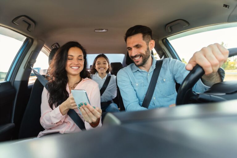family in a car on a road trip - how to plan a road trip