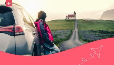 Girl leaning against her car - How to plan a road trip