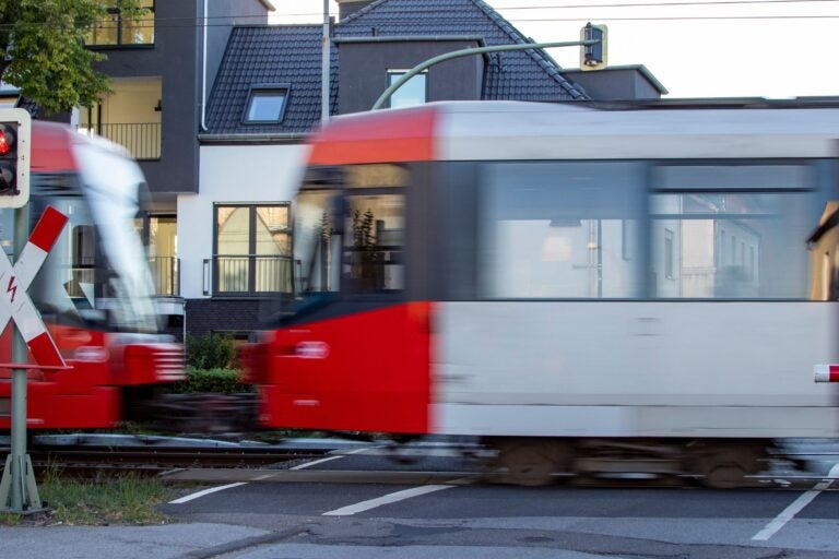 Cologne tram at a street crossing traffic light.