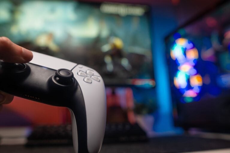 Modern gamepad in the player's hand.