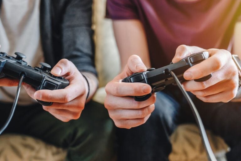 Young men playing video games