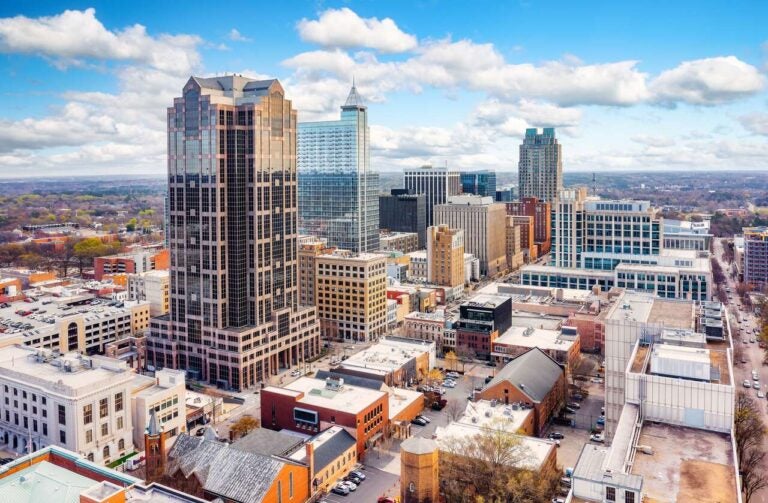 Aerial view of downtown Raleigh, North Carolina, with modern high-rise buildings.