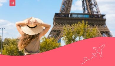 woman in front of the Eiffel Tower in Paris - cost of living in France