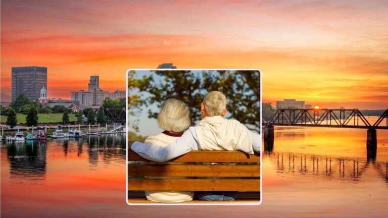 Augusta, Georgia cityscape and an older couple sitting on a bench