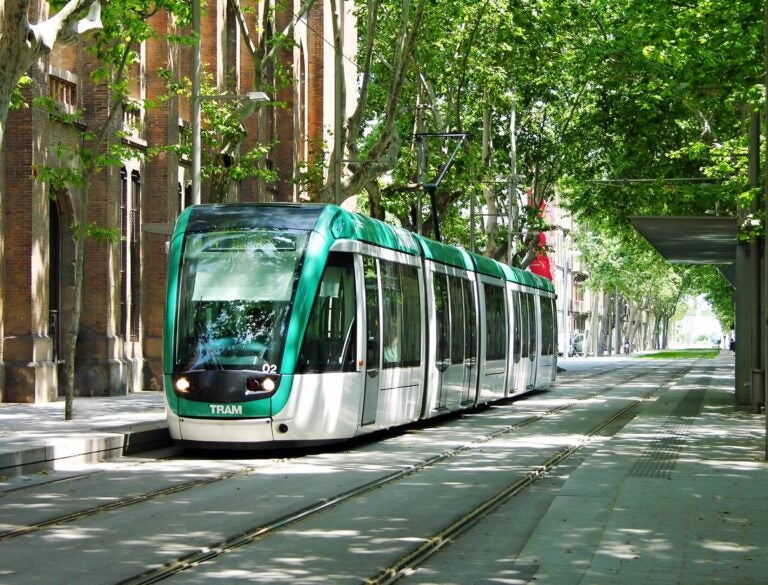 modern barcelona tram in a local street