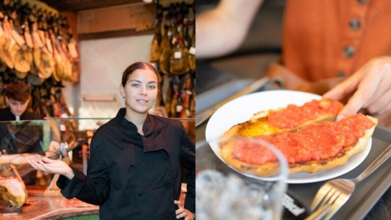 A Spanish food market with cured meats and a traditional tomato-topped dish, illustrating food and grocery options in Spain.