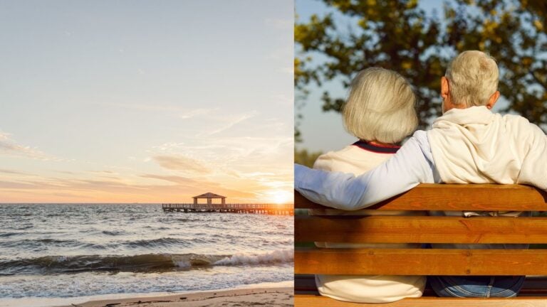 A Gulf Shores beach at sunset beside an older couple relaxing on a bench.