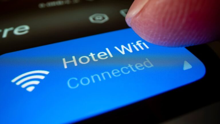Close-up of a smartphone screen connecting to a hotel Wi-Fi network.