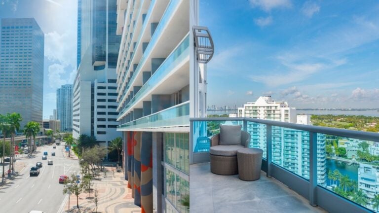Miami cityscape showing modern high-rise buildings and a residential balcony overlooking the waterfront.