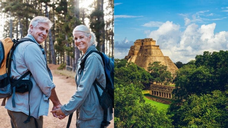 A retired couple hiking beside an ancient Mayan pyramid near Mérida, Mexico.