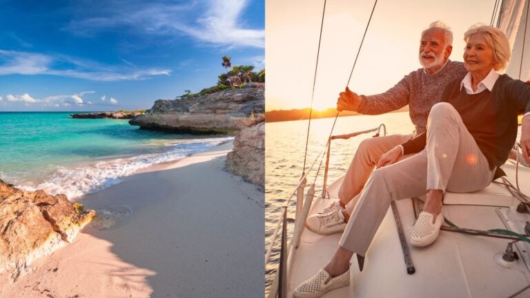 A retired couple sailing beside a Caribbean beach in Playa del Carmen, Mexico.