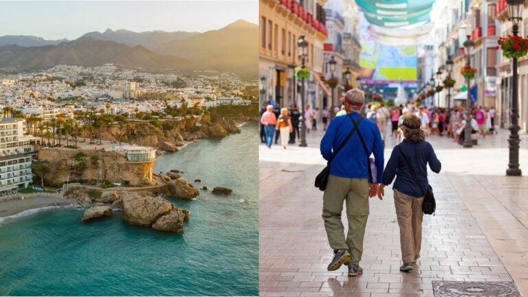 A Spanish coastal town beside an older couple walking along a busy city street.