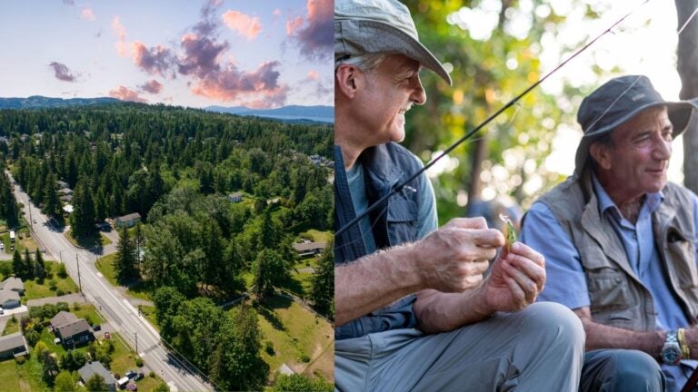 Tree-covered neighborhood in Bellingham alongside two older men fishing.
