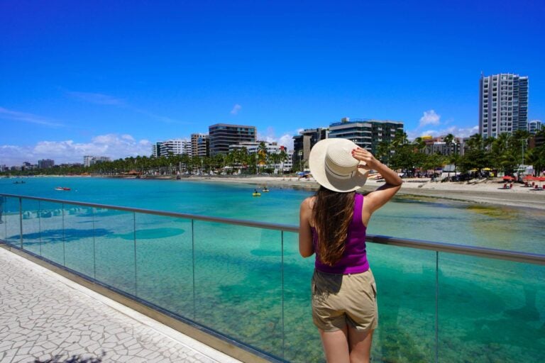 woman stadning close to the beach in brazil