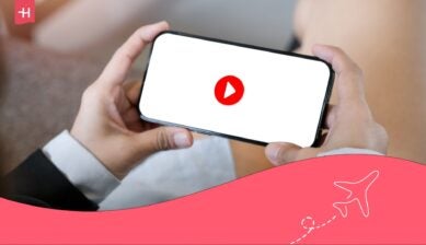 Woman holding a phone in attempt to watch a YouTube video