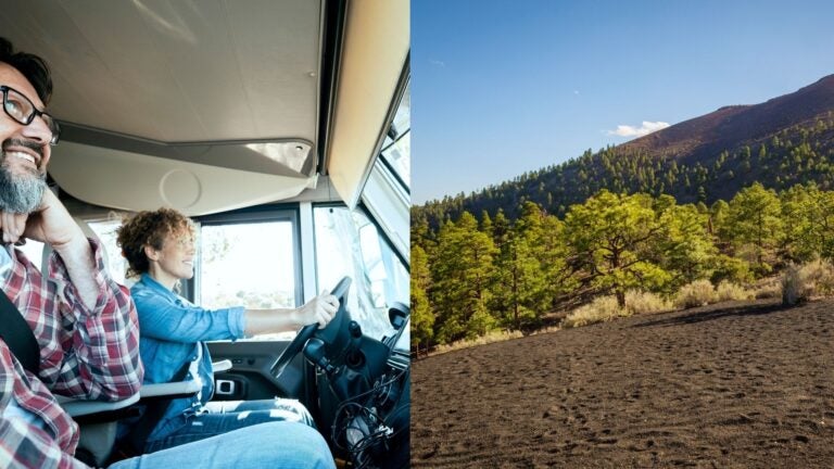 Couple traveling by motorhome beside a forested volcanic landscape near Flagstaff