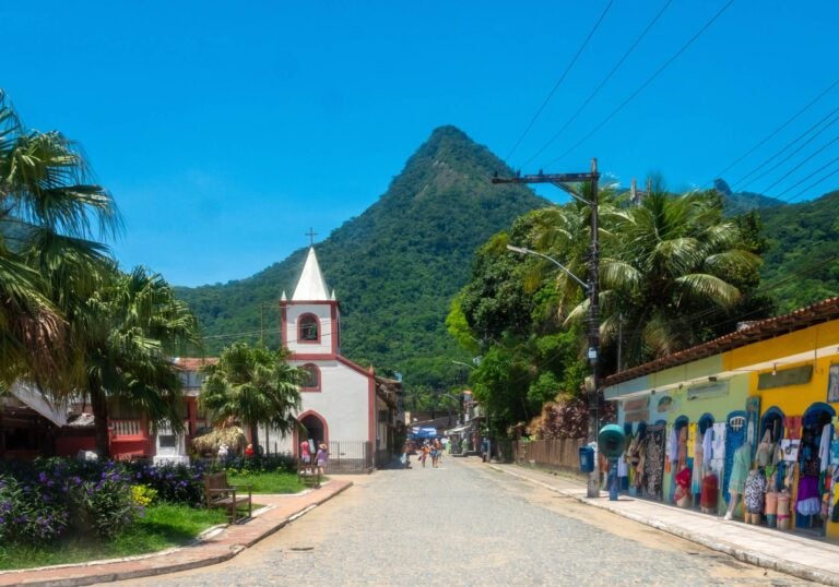an old street at ilha grande with some people walking on it