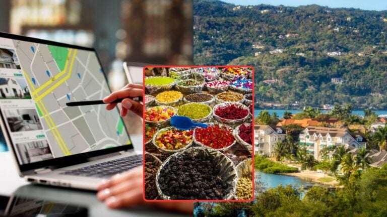Laptop displaying a map beside a colorful market of local goods, with a tropical Jamaican landscape and waterfront homes in the background.