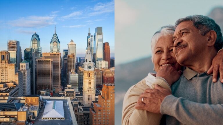 Philadelphia skyline beside a retired couple embracing.