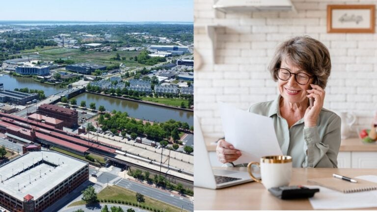Wilmington riverfront beside an older woman reviewing paperwork on the phone.