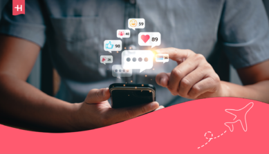 Person using a smartphone with floating message notifications and social media icons.