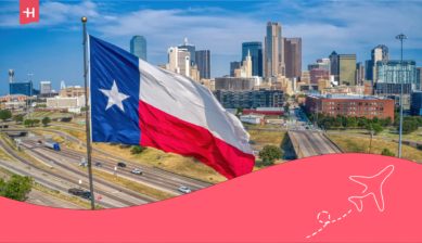 Texas flag waving in front of the Dallas skyline, with highways in the foreground.