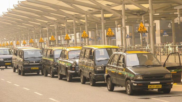 Taxis lined up waiting for passengers outside Delhi airport
