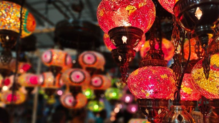 Colorful Diwali lanterns hanging for sale at a street market in India