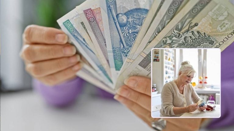 Counting Polish Zloty banknotes to manage the cost of living in Poland.