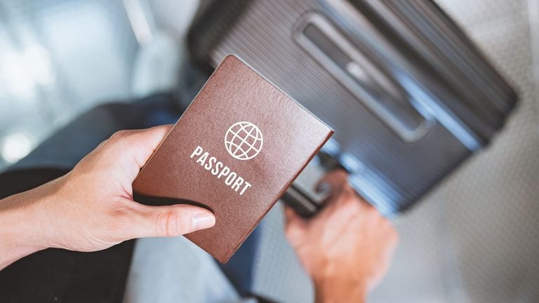 Traveler holding a passport at the airport
