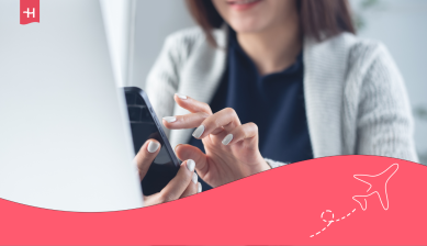 Woman using a smartphone beside a laptop, with Holafly branding and an airplane illustration.