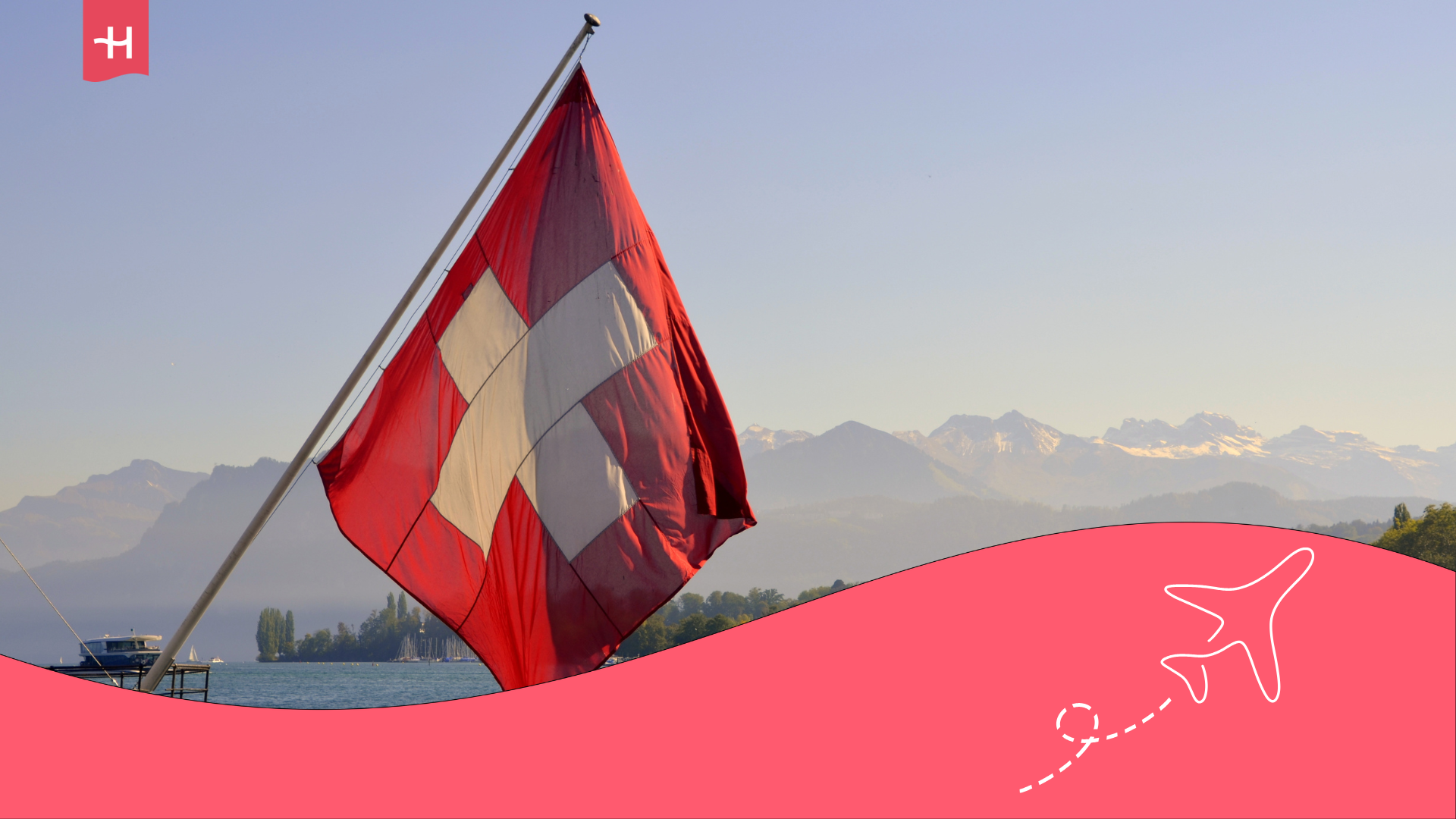 Eine schweizer Flagge vor einer Berglandschaft
