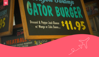 Ein Schild vor einem Restaurant, das Gator Burger anpreist.