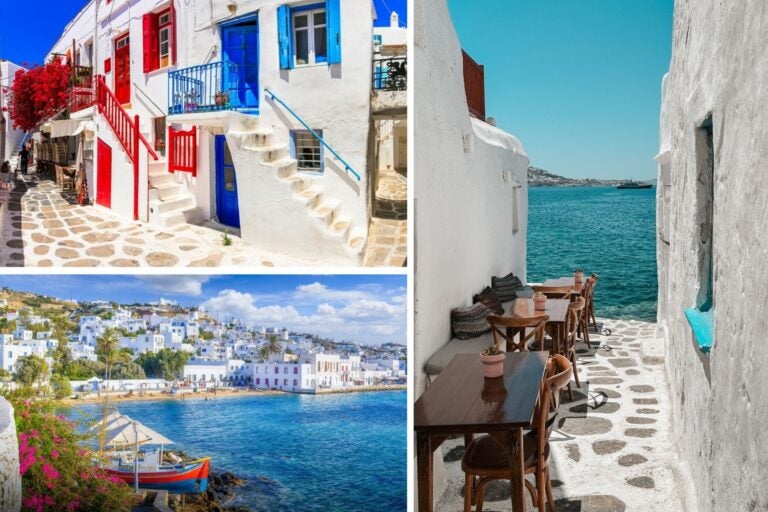 Casitas blancas con puertas en rojo y azul en Mykonos y playa con barcos
