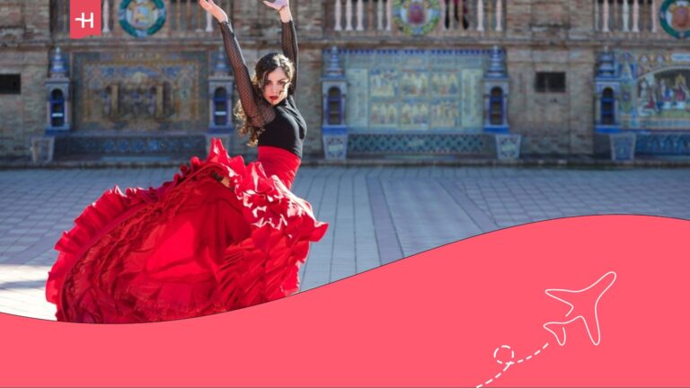 Mujer vestida de flamenca con falda roja bailando en la Plaza de España, Sevilla.