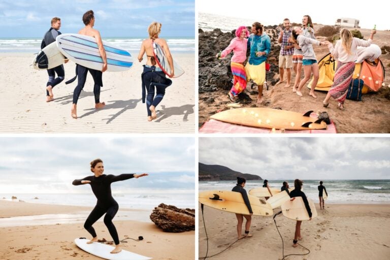 Varias personas con tabla de surf  practicando este deporte y también disfrutando.