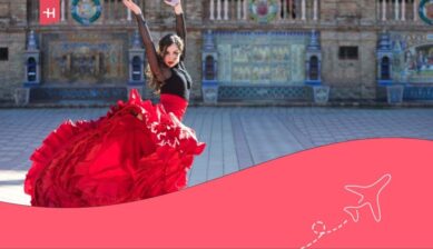 donna vestita da flamenca con gonna rossa che balla nella plaza de españa, siviglia.