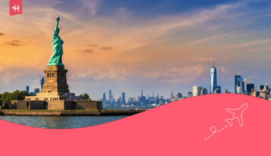 Foto van het vrijheidsbeeld en de skyline van New York als uitgelichte afbeelding voor een artikel over bellen naar Amerika vanuit Nederland