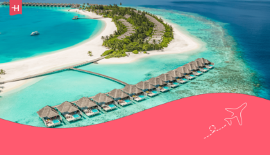 Luchtfoto van luxe villa's op het water in de Malediven als uitgelichte afbeelding voor een artikel over de beste reistijd voor de Malediven