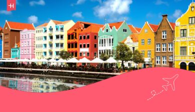 Kleurrijke huisjes van Willemstad als uitgelichte afbeelding voor een artikel over geld wisselen voor Curaçao
