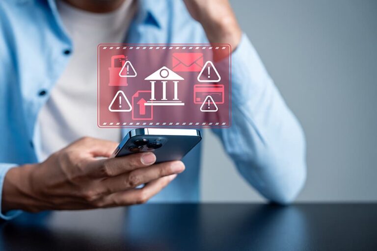 スマートフォンに表示された金融トラブルの警告アイコン