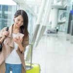airport-woman-using-phone.jpg